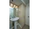 Bathroom with pedestal sink and built-in storage at 377 King St # 101, Charleston, SC 29401