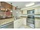 Modern kitchen with granite countertops and exposed brick wall at 377 King St # 101, Charleston, SC 29401