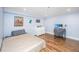Bedroom with a double bed, dresser, and hardwood floors at 377 King St # 101, Charleston, SC 29401