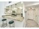 Modern kitchen with granite countertops and stainless steel appliances at 377 King St # 101, Charleston, SC 29401