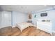 Small bedroom with a single bed and dresser at 377 King St # 101, Charleston, SC 29401