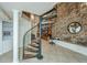 Unique spiral staircase with metal railing and wood steps at 377 King St # 101, Charleston, SC 29401