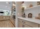 Butler's pantry with white shelving and patterned wallpaper at 601 Yellow Leaf Ln, Summerville, SC 29486