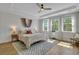 Main bedroom with hardwood floors, large windows, and wood ceiling fan at 601 Yellow Leaf Ln, Summerville, SC 29486
