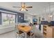 Bright dining room with a wooden table and chairs, and a view of the living room at 305 Foxhound Court, Goose Creek, SC 29445