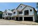 New townhome community under construction, featuring multiple units with attached garages at 420 Carolina Cherry Ct # 102, Charleston, SC 29414