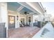 Brick porch with ceiling fan and seating area at 420 Carolina Cherry Ct # 102, Charleston, SC 29414