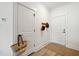 Bright and airy entryway with coat hooks and a stylish jute rug at 420 Carolina Cherry Ct # 102, Charleston, SC 29414
