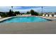 Community pool with lounge chairs, ready for relaxation at 3701 Docksite Rd # 113, Edisto Island, SC 29438