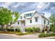 Two story white house with gray roof and landscaping at 1467 Alligator Creek Ct # 104, Awendaw, SC 29429