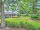 Brick house with mature landscaping and a large front yard at 110 W 2Nd South St, Summerville, SC 29483