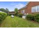 Landscaped side yard with generator and propane tank at 200 Broughton Rd, Moncks Corner, SC 29461