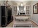 Round dining table in a well-lit dining area with built-in cabinets at 200 River Landing Dr # 105F, Charleston, SC 29492