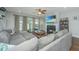 Spacious living room with sectional sofa, fireplace, and hardwood floors at 513 Abigail St, Moncks Corner, SC 29461