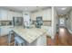 Island kitchen features granite countertops, stainless steel appliances, and hardwood floors at 513 Abigail St, Moncks Corner, SC 29461