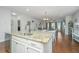 Kitchen boasts a granite island, stainless steel appliances, and hardwood floors at 513 Abigail St, Moncks Corner, SC 29461