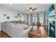 Living area features a sectional sofa, fireplace, and hardwood floors at 513 Abigail St, Moncks Corner, SC 29461