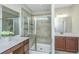 Double vanity bathroom with a large walk-in shower and tiled floors at 513 Abigail St, Moncks Corner, SC 29461