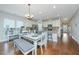 Bright dining area features a white table with gray bench seating at 513 Abigail St, Moncks Corner, SC 29461