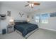 Spacious main bedroom with king-size bed and ample natural light from two large windows at 513 Abigail St, Moncks Corner, SC 29461