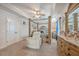 Spacious bedroom with a four-poster bed, recliner, and large dresser at 1405 Tannery Row, Johns Island, SC 29455