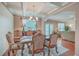 Spacious dining room with hardwood floors, access to the backyard, and living room view at 1405 Tannery Row, Johns Island, SC 29455