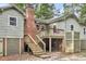 Back exterior of raised beach cottage with deck at 410 Four Holes Road, Dorchester, SC 29437