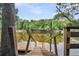 Rustic wooden dock extending over calm river water at 410 Four Holes Road, Dorchester, SC 29437