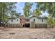 Simple raised beach cottage with mature trees at 410 Four Holes Road, Dorchester, SC 29437