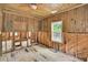 Bedroom with wood walls and flooring, ready for renovation at 410 Four Holes Road, Dorchester, SC 29437