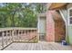 Deck extends alongside home, brick chimney feature at 410 Four Holes Road, Dorchester, SC 29437