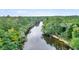 Aerial view of a river surrounded by lush greenery at 410 Four Holes Road, Dorchester, SC 29437