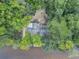 Aerial view of home nestled in trees near river at 410 Four Holes Road, Dorchester, SC 29437