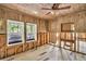 Spacious bedroom with two windows and ceiling fan, under renovation at 410 Four Holes Road, Dorchester, SC 29437