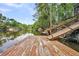 Wooden dock with access to calm river water at 410 Four Holes Road, Dorchester, SC 29437