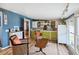 Relaxing sunroom with wicker chairs and built-in bar at 924 W Oceanview Rd, Charleston, SC 29412