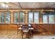 Charming water view dining area with a rustic table and chairs at 924 W Oceanview Rd, Charleston, SC 29412