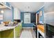 Bright kitchen with wood floors and chalkboard wall at 924 W Oceanview Rd, Charleston, SC 29412