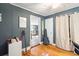 Cozy bedroom with hardwood floors and access to another room at 924 W Oceanview Rd, Charleston, SC 29412