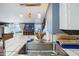 Modern kitchen sink with stylish faucet and tile counter at 924 W Oceanview Rd, Charleston, SC 29412
