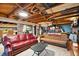Finished basement with leather couches and surfboard storage at 924 W Oceanview Rd, Charleston, SC 29412