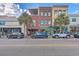 Street view of a commercial building among other shops at 487 King St # 202 Penthouse, Charleston, SC 29403