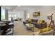 Spacious living room with gray sectional sofa and large TV at 487 King St # 202 Penthouse, Charleston, SC 29403