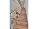 Modern staircase with dark wood steps and metal railing at 487 King St # 202 Penthouse, Charleston, SC 29403