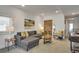 Modern living room with gray sectional and stylish accent pillows at 487 King St # 202 Penthouse, Charleston, SC 29403