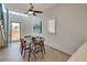 Bright dining area with glass table and modern chairs, near kitchen at 487 King St # 202 Penthouse, Charleston, SC 29403