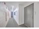 Clean hallway with carpet and grey door at 487 King St # 202 Penthouse, Charleston, SC 29403