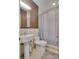 Clean bathroom with white sink, toilet and shower at 487 King St # 202 Penthouse, Charleston, SC 29403