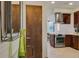Entryway with a view into the modern kitchen at 487 King St # 202 Penthouse, Charleston, SC 29403
