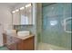 Modern bathroom with dual sinks and a walk-in shower at 487 King St # 202 Penthouse, Charleston, SC 29403
